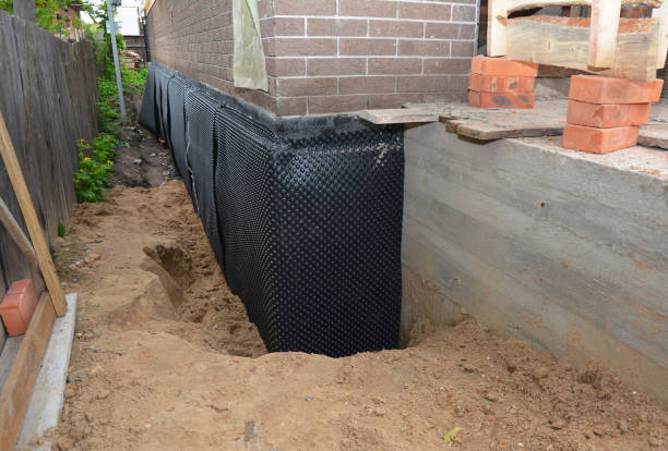 SJ Waterproofing Pros technician performing targeted Wet Basement Repair assessment in Birmingham, NJ